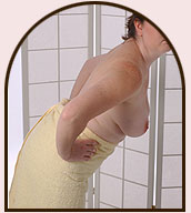 Look at each breast as you turn slowly from side to side.